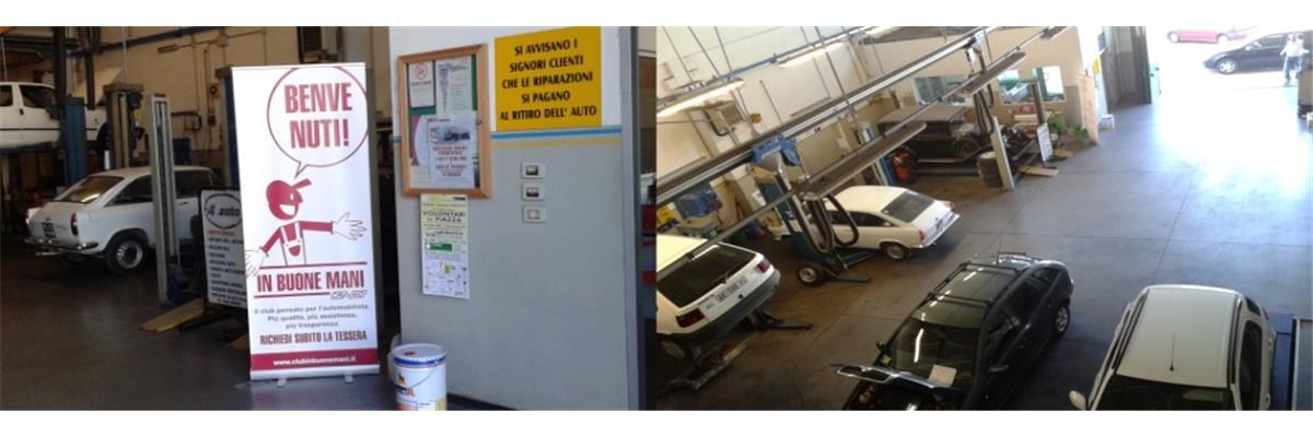Vista interna dell'officina con pneumatici e attrezzatura per il cambio gomme